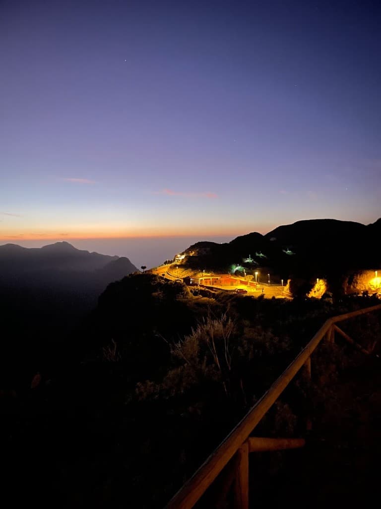 Mountain ridge viewpoint glowing at dusk