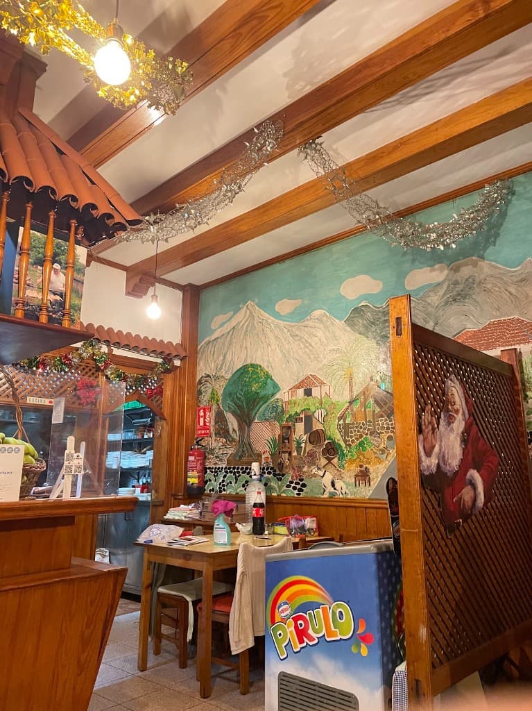 Interior of Guachinche Las Galanas with a mural of Teide