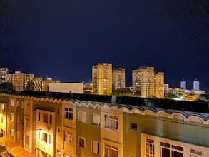 Night view over Santa Cruz with Torres de Santa Cruz on the skyline